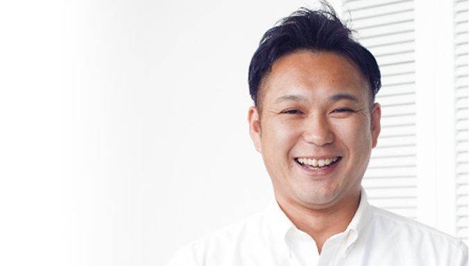 優しい笑顔の琉球アーバンホーム取締役 事業長　川田　悟の写真
